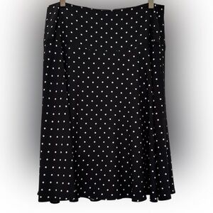 White House Black Market black and white polka dotted skirt, size 10.
